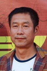 董军（刘佩琦饰演）